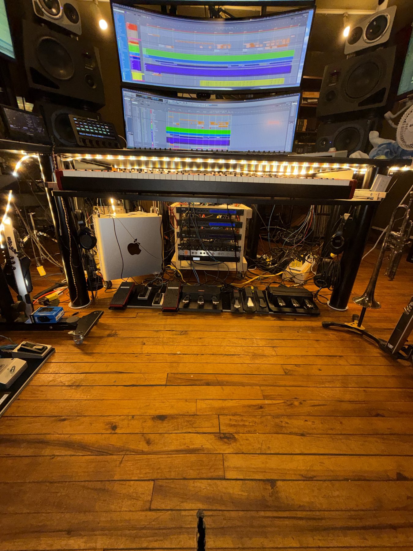 Audiomind studio desk, rack gear, monitors, and wood floor